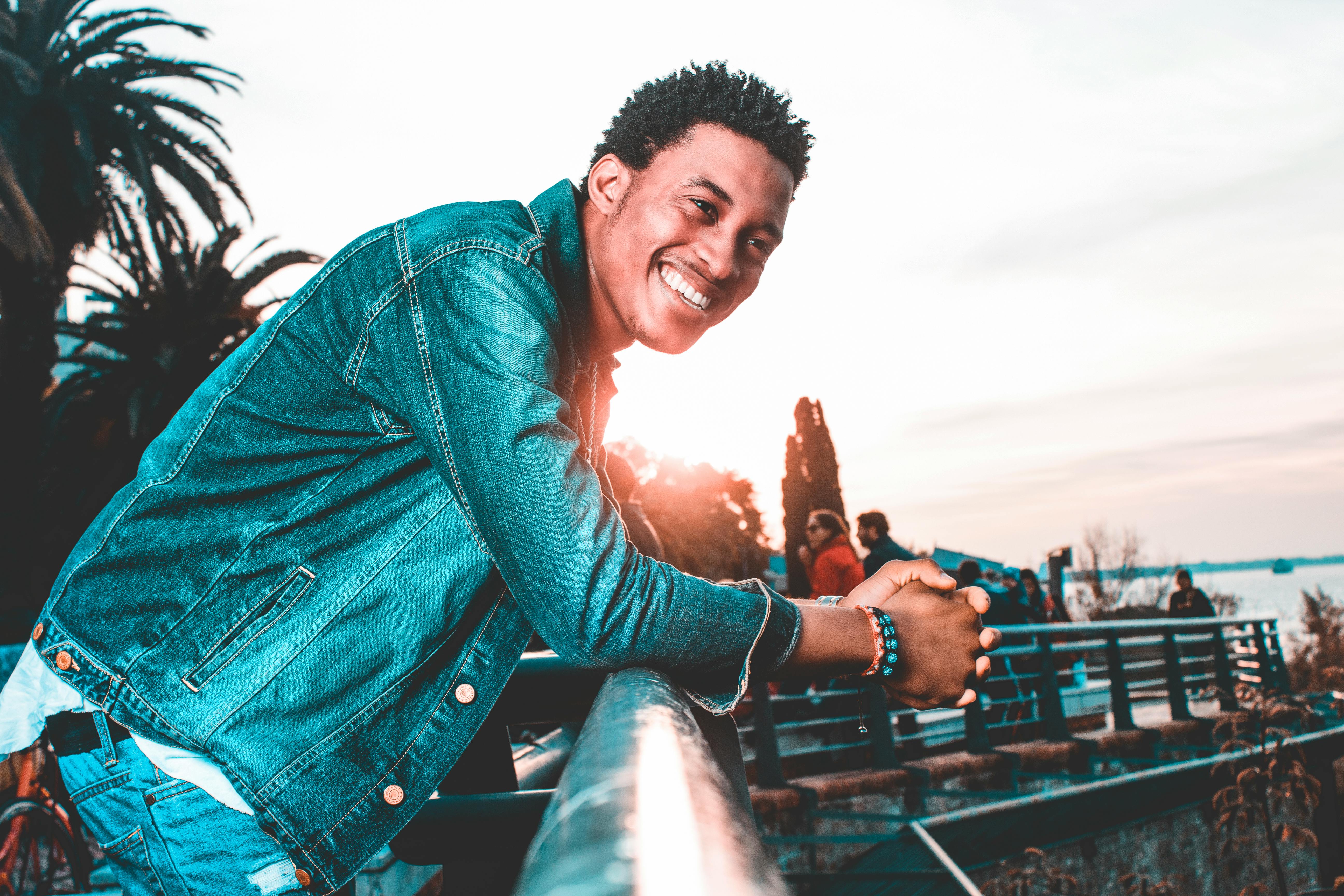 Coco Martin smiling outdoors at sunset — founder of CocoGlow Naturals